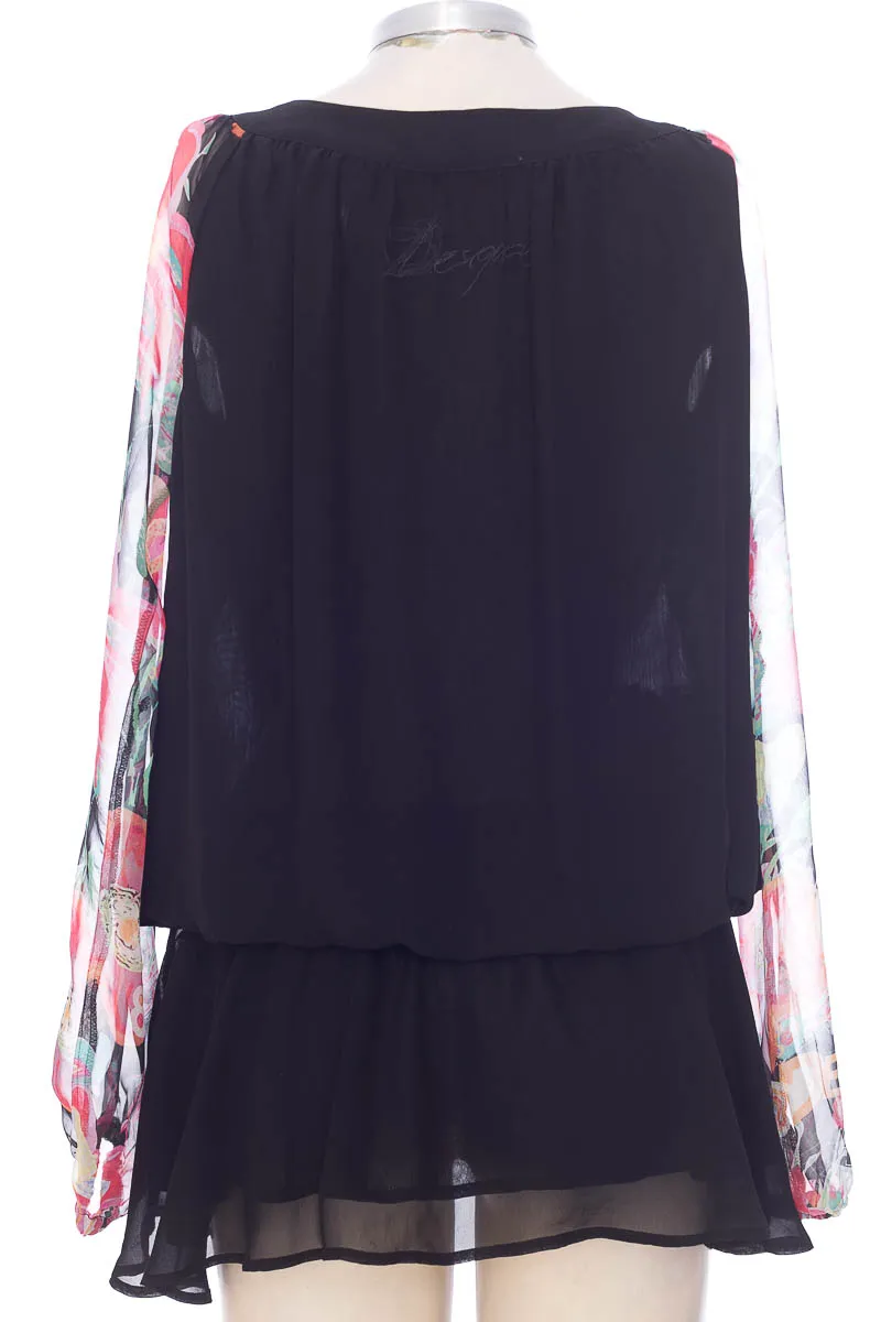 BLUSA COLOR NEGRO  DESIGUAL