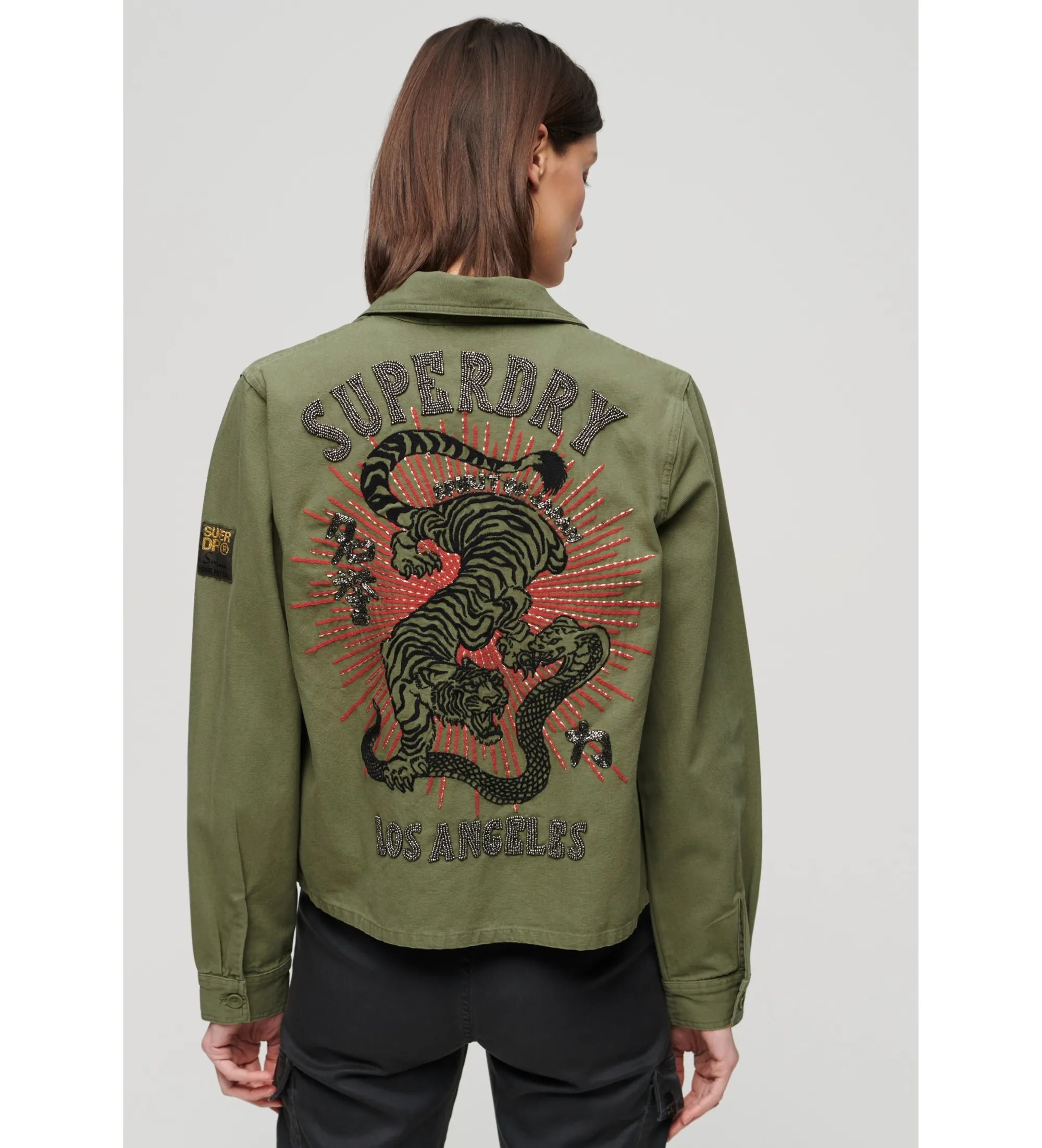 Chaqueta militar adornada verde