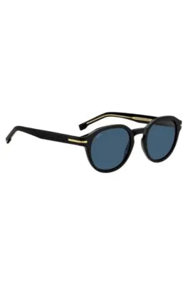 Gafas de sol de acetato negro con bisagras en tono dorado