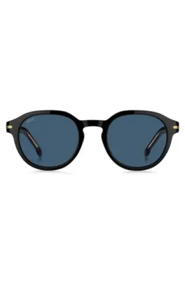 Gafas de sol de acetato negro con bisagras en tono dorado