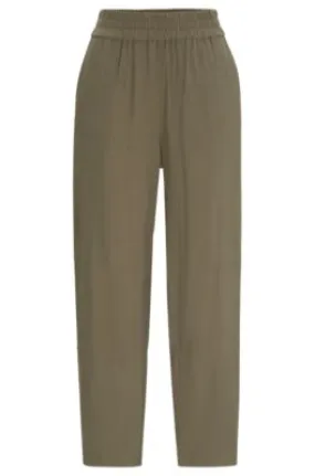 Pantalones regular fit con corte cónico